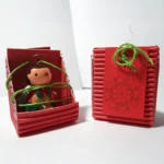 Ángel navideño en empaque protector de cartón semicorrugado