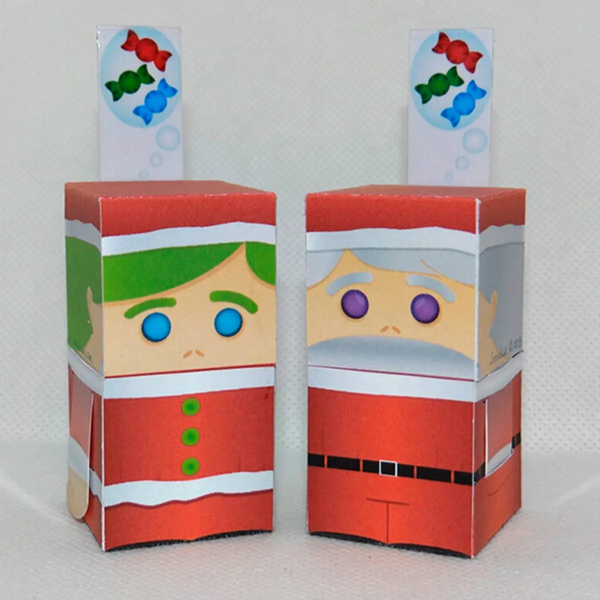 empaques navideños de santa y duende cerrados vista frontal