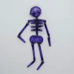 Prendedor de esqueleto morado en porcelanicrón