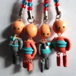 Figuras de pareja en porcelanicrón gris y coral